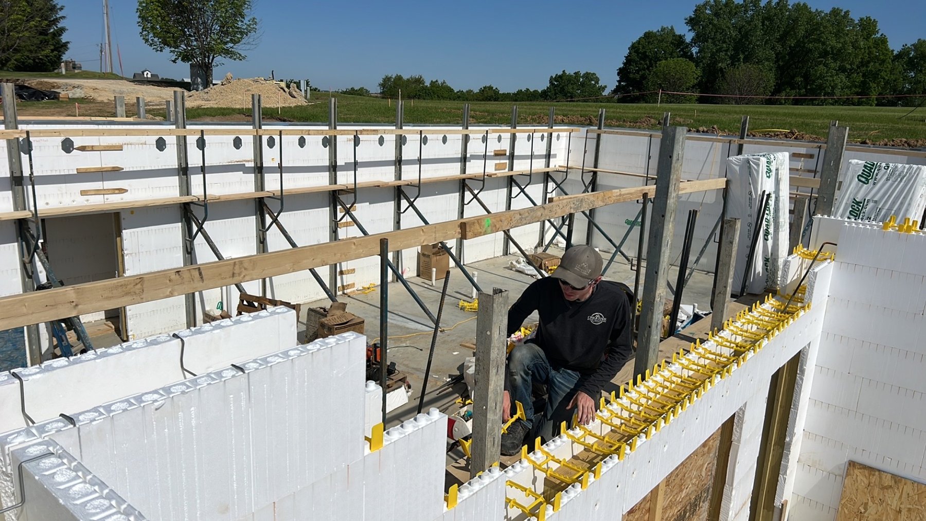ICF wall construction showing foam panels, yellow ties and alignment bracing